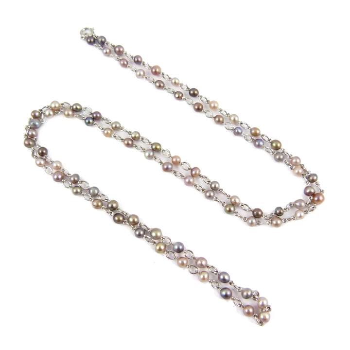 Natural coloured pearl chain necklace, in various shades of brown, grey and black, some iridescent, each with platinum trace link in between
